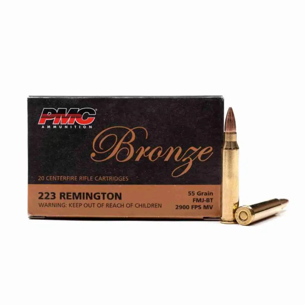 Box of PMC .223 Remington 55-grain full-metal-jacket boat-tail (FMJ-BT) cartridges — 20 rounds, brass casings with visible product label.