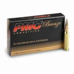 Box of PMC .308 Winchester 147-grain full metal jacket boat-tail cartridges (20 rounds) with visible product label and brass casings.