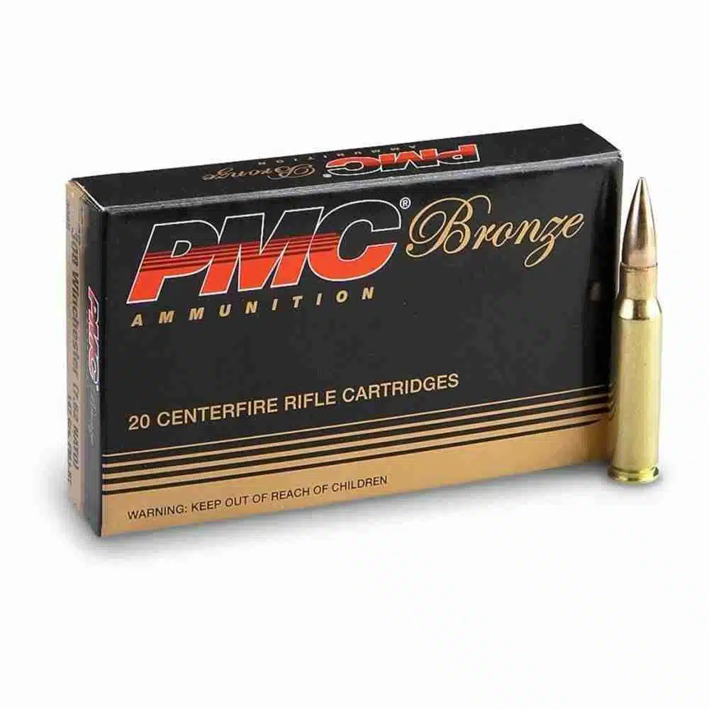 Box of PMC .308 Winchester 147-grain full metal jacket boat-tail cartridges (20 rounds) with visible product label and brass casings.