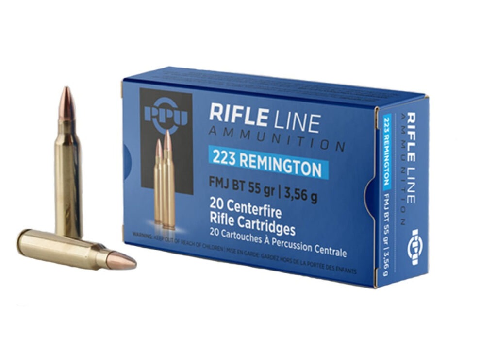 Box of PPU .223 Remington 55gr boat-tail full metal jacket cartridges (20 rounds) with visible product label and brass casings.